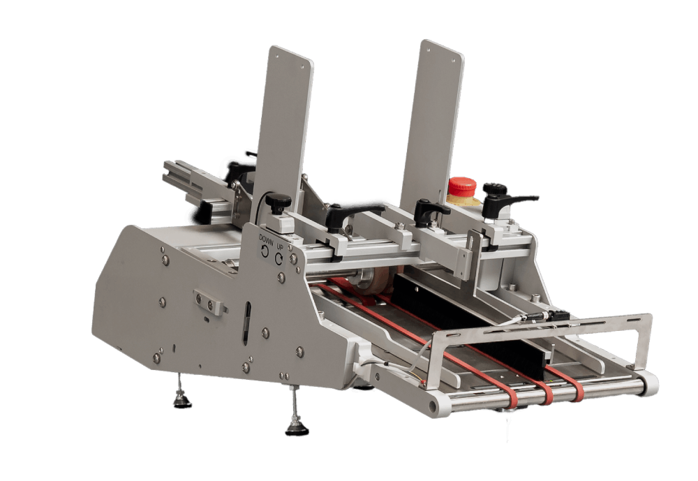 Close-up of Rollenco friction feeder with adjustable belts and guides for precise feeding